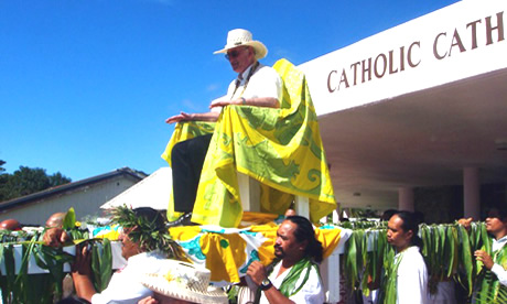 Bishop Paul Donoghue carried in a 'sede gestatoria'