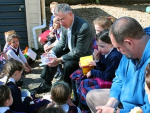 Archbishop John Dew working with youth